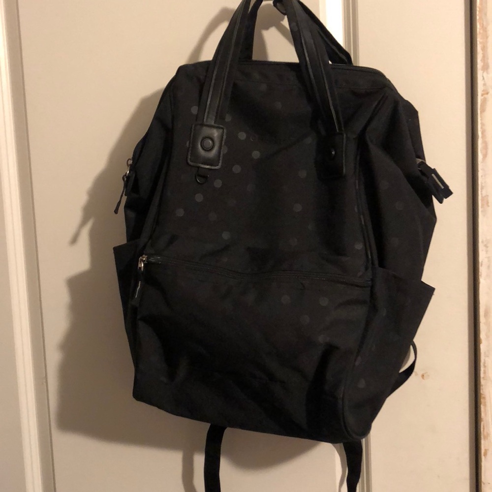Black polka dot backpack